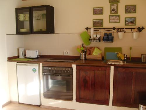 Kuchyňa alebo kuchynka v ubytovaní Kiserdei Apartman