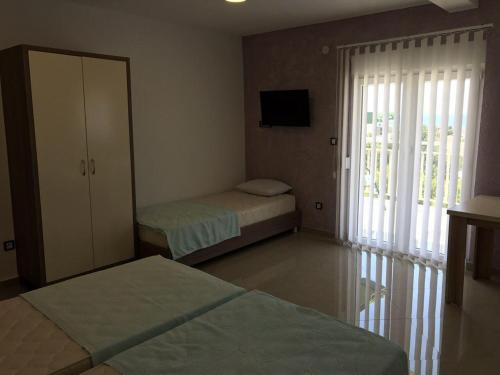 Postel nebo postele na pokoji v ubytování Vip Apartmani Canj