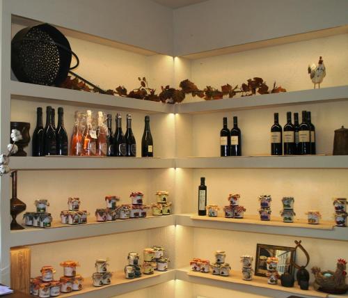 a room with shelves filled with bottles of wine at Agriturismo Forest in Iseo