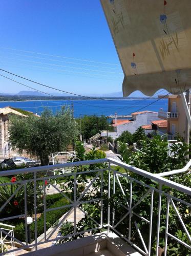 a view of the ocean from the balcony of a building at Erato Apartments in Petalidhion