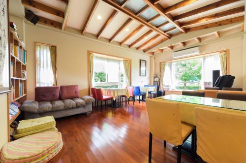 a living room with a couch and a table at Yosemite Homestay in Yuanshan