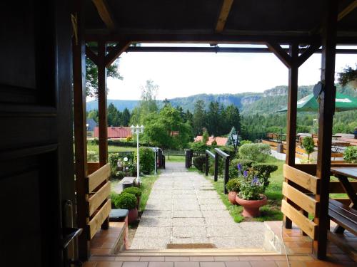 a view from the entrance to a garden at Penzion u Marešů in Hřensko