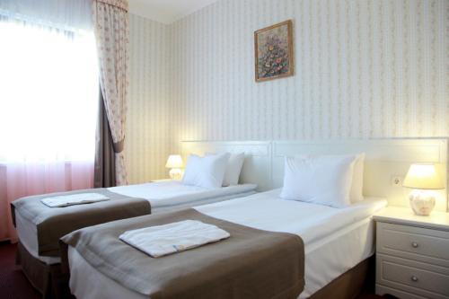 Postel nebo postele na pokoji v ubytování Knyazhyi Dvir