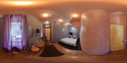 a bedroom with a bed in a room with a large pillar at YELLOW UNLIMITED HOTEL 4 in Kharkiv