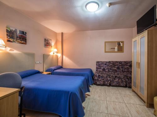 Postel nebo postele na pokoji v ubytování Hotel Legazpi