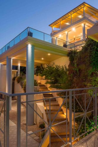 a house with a staircase leading up to it at Balos Beach in Kissamos