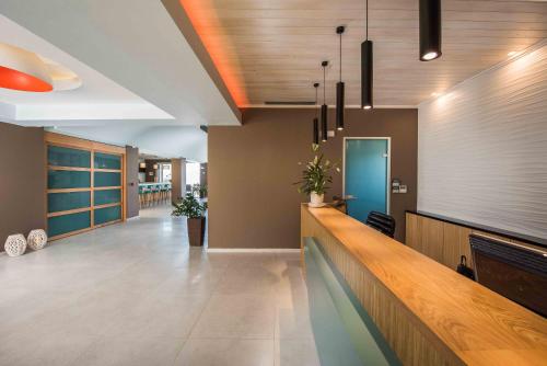 a lobby with a bar in a building at Balos Beach in Kissamos