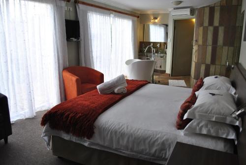Postel nebo postele na pokoji v ubytování Kududu Guest House