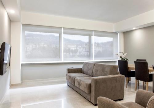 a living room with a couch and a table at B&B Tufilla in Ascoli Piceno