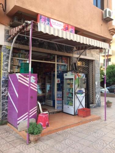 a store front with a pay phone and a machine at Appartement Wassim - Gueliz in Marrakech