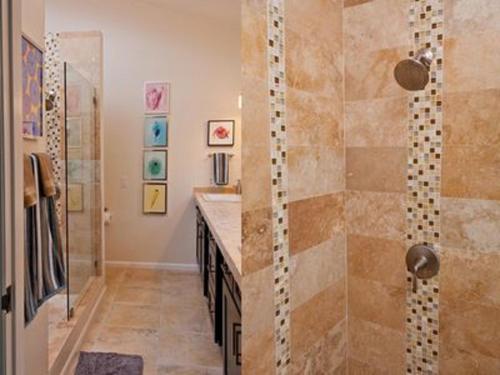 a bathroom with a shower and a sink at Hidden Valley Villa in Teagues Bay