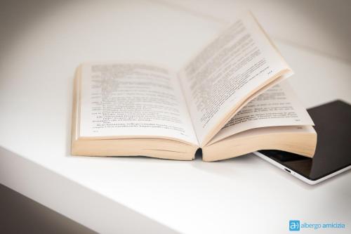 an open book sitting on top of a table at Hotel Amicizia in Rimini