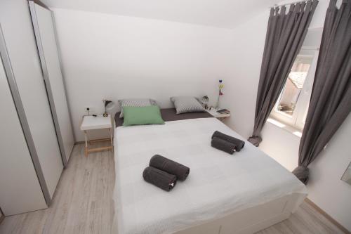 Postel nebo postele na pokoji v ubytování Apartment Smokva ****