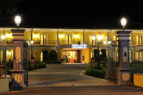 a building with a sign that reads private at night at Hotel Lido - Beach and Palace in Bolsena