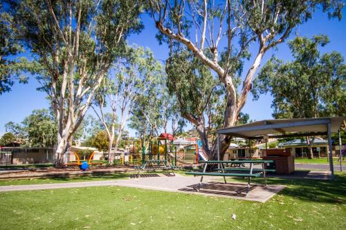 a park with a bench and a playground at BIG4 Mannum Holiday Park in Mannum