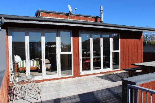 a screened in porch of a house with windows at Kaltech House - Lake Tekapo in Lake Tekapo