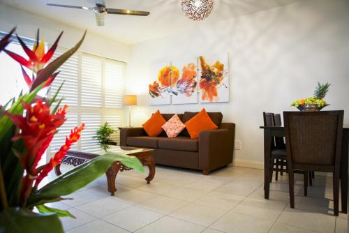 a living room with a couch and a table at 5313 BEACH CLUB CORAL SUITE in Palm Cove
