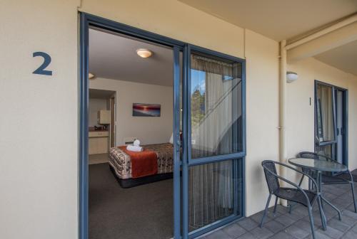 a room with a door leading to a bedroom at Bella Vista Nelson in Nelson