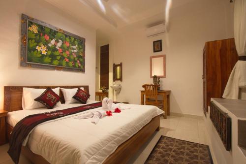 Postel nebo postele na pokoji v ubytování Uma Loris Ubud