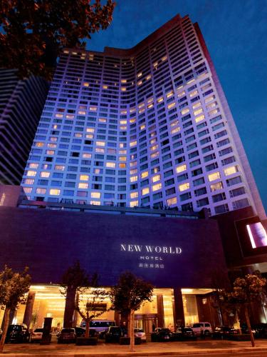 a new world building with the words new world on it at New World Dalian Hotel in Dalian