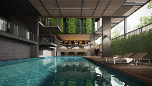 una imagen de una piscina en un edificio en Happy 3, en Bangkok