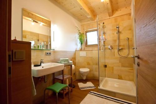 a bathroom with a shower and a sink and a shower at Ferienhof Weltenburg in Kelheim