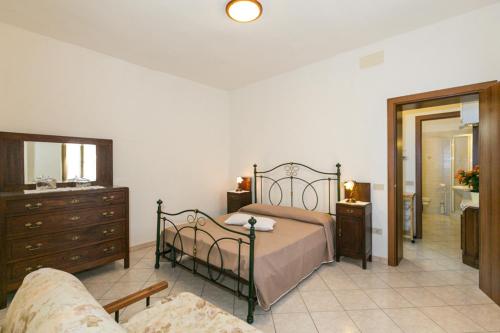 Ένα ή περισσότερα κρεβάτια σε δωμάτιο στο Agriturismo Case Nuove