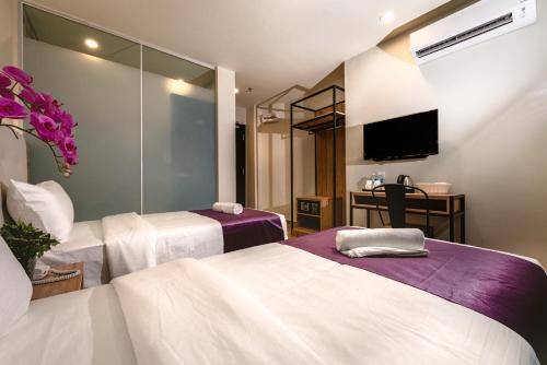 Postel nebo postele na pokoji v ubytování BIG M Hotel
