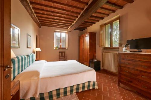 Łóżko lub łóżka w pokoju w obiekcie Borgo Il Melone
