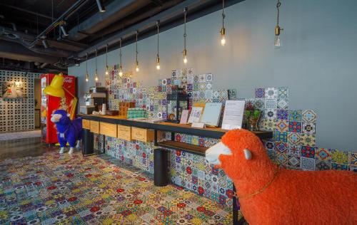 a store with a stuffed animal sitting in front of a counter at attitude on granville in Hong Kong