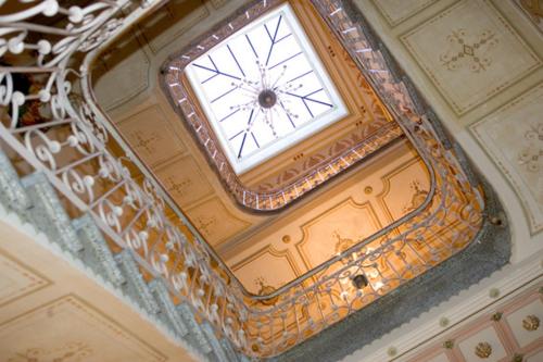 a ceiling with a clock on top of a building at Hotel la Vila in Sóller