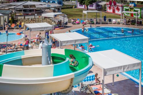 an image of a pool with people playing in the water at Kipriotis Village Resort in Kos Town