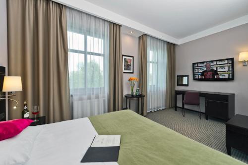 Posteľ alebo postele v izbe v ubytovaní Hotel Fado Spa & Restaurant