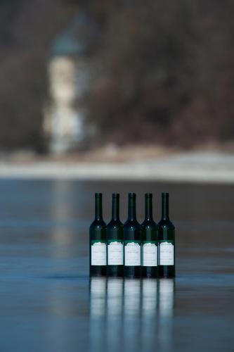 four bottles of wine sitting on a table at Appartementhotel Röhrenbach in Immenstaad am Bodensee