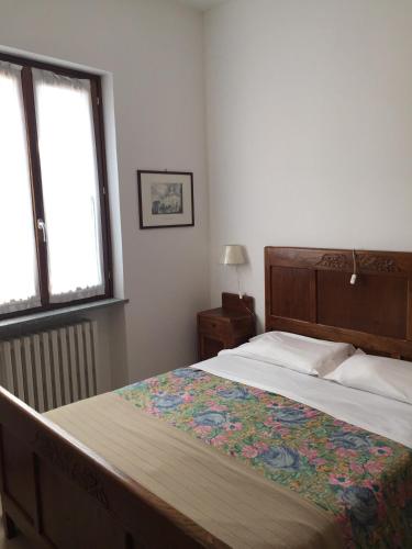 Кровать или кровати в номере Barolo Apartments