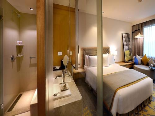Ένα ή περισσότερα κρεβάτια σε δωμάτιο στο Welcomhotel by ITC Hotels, RaceCourse, Coimbatore
