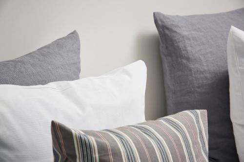 a group of pillows sitting next to each other at Haraldskær Sinatur Hotel & Konference in Vejle