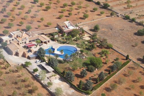 an aerial view of a house with a swimming pool at Agroturismo Finca Sa Tanca in Cala d´Or