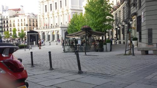 a street with a gazebo in the middle of a city at Oriente Palace Apartments in Madrid