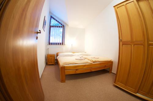 Postel nebo postele na pokoji v ubytování Apartmány Biela Púť 17 - 18