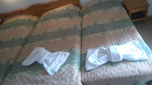 Postel nebo postele na pokoji v ubytování Hotel Aidipsos