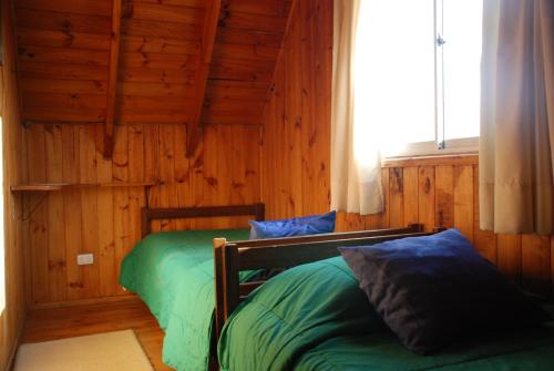 Кровать или кровати в номере Cabañas Diquen's El Tabo