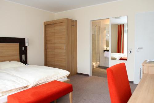 Ένα ή περισσότερα κρεβάτια σε δωμάτιο στο Hotel Wiehen-Therme