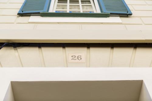 a building with a window with the number at Bordoy Casa Ládico - Hotel Boutique Adults Only in Mahón