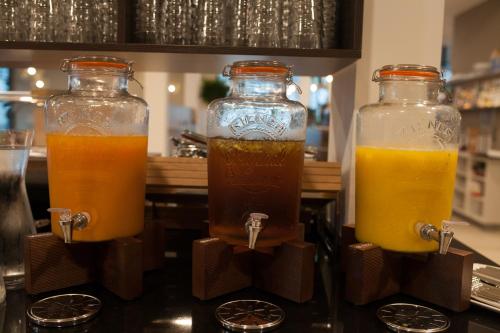 two bottles of juice sitting on top of a counter at Best Western Hotel Tulln in Tulln
