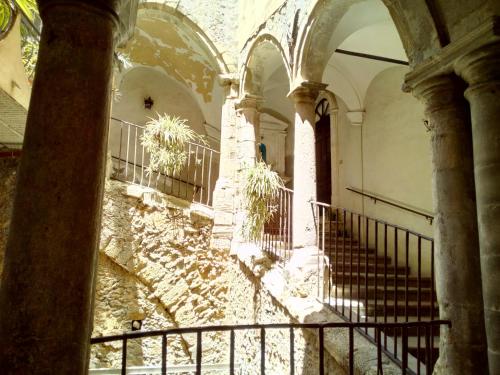a view of a staircase in a building at Palazzo Aprile in Caltagirone