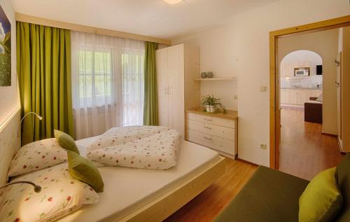 Postel nebo postele na pokoji v ubytování Apartments & Wellness Löfflerblick