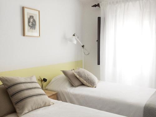 Ένα ή περισσότερα κρεβάτια σε δωμάτιο στο Foral Guest House - Óbidos