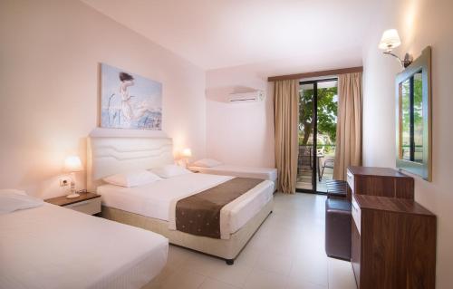 Кровать или кровати в номере Hotel Rema