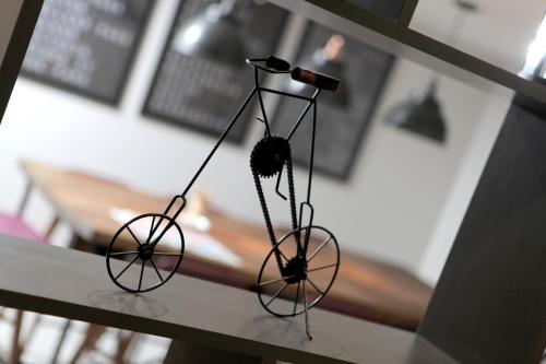 a metal object is hanging on a table at Best Western White House Hotel in Watford